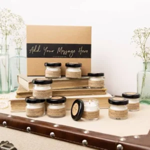 Beeswax candle jars on stacked books with gift box display